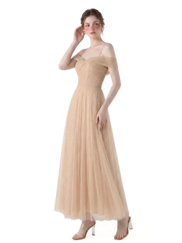 Model posing in an Aunomay tulle off shoulder midi dress with pleated detailing and a flowing pastel tulle skirt.