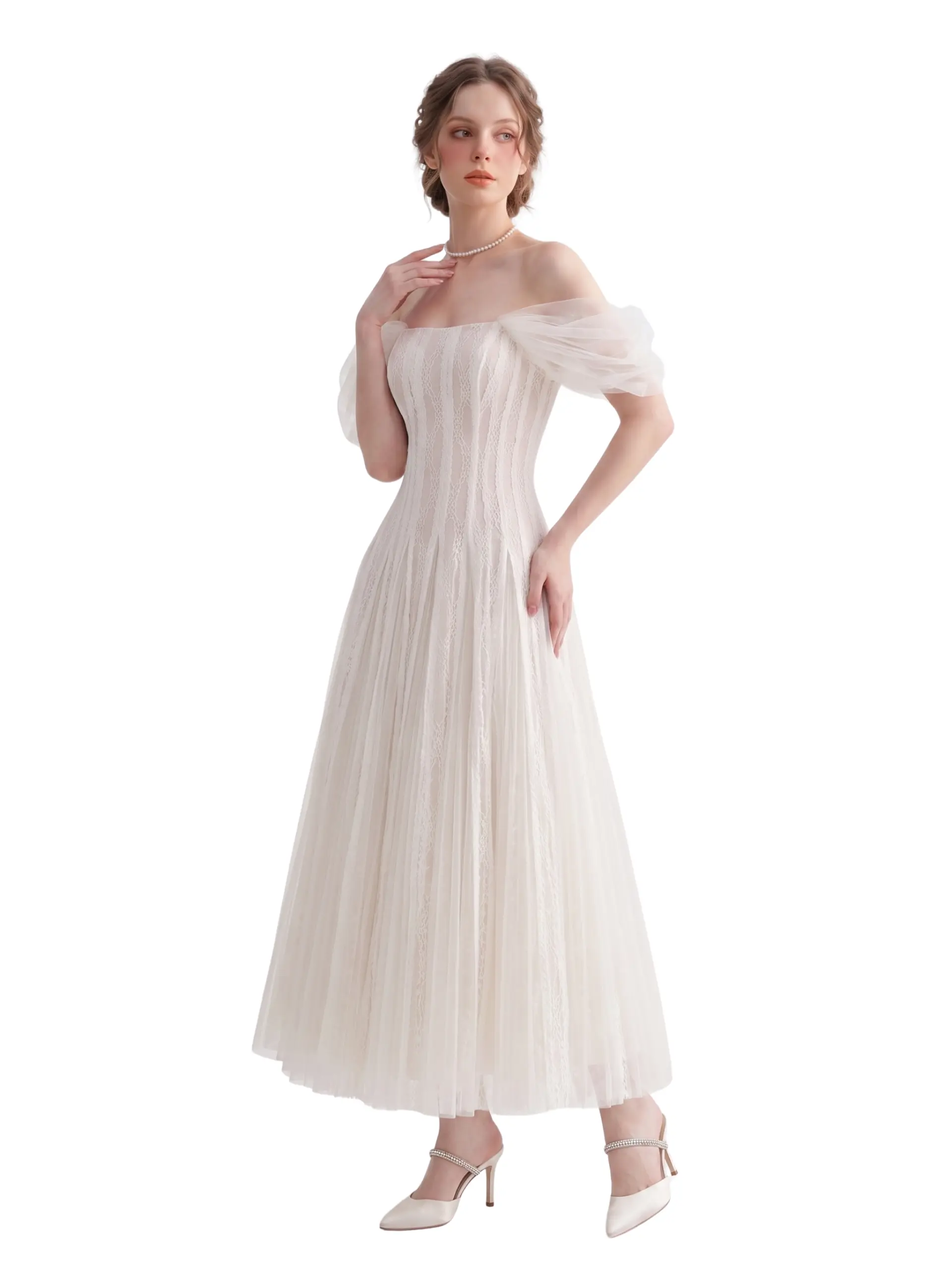 Woman wearing the Cicela white lace off-the-shoulder corset dress with sheer tulle sleeves, a fitted lace bodice, and a flowing tea-length skirt.