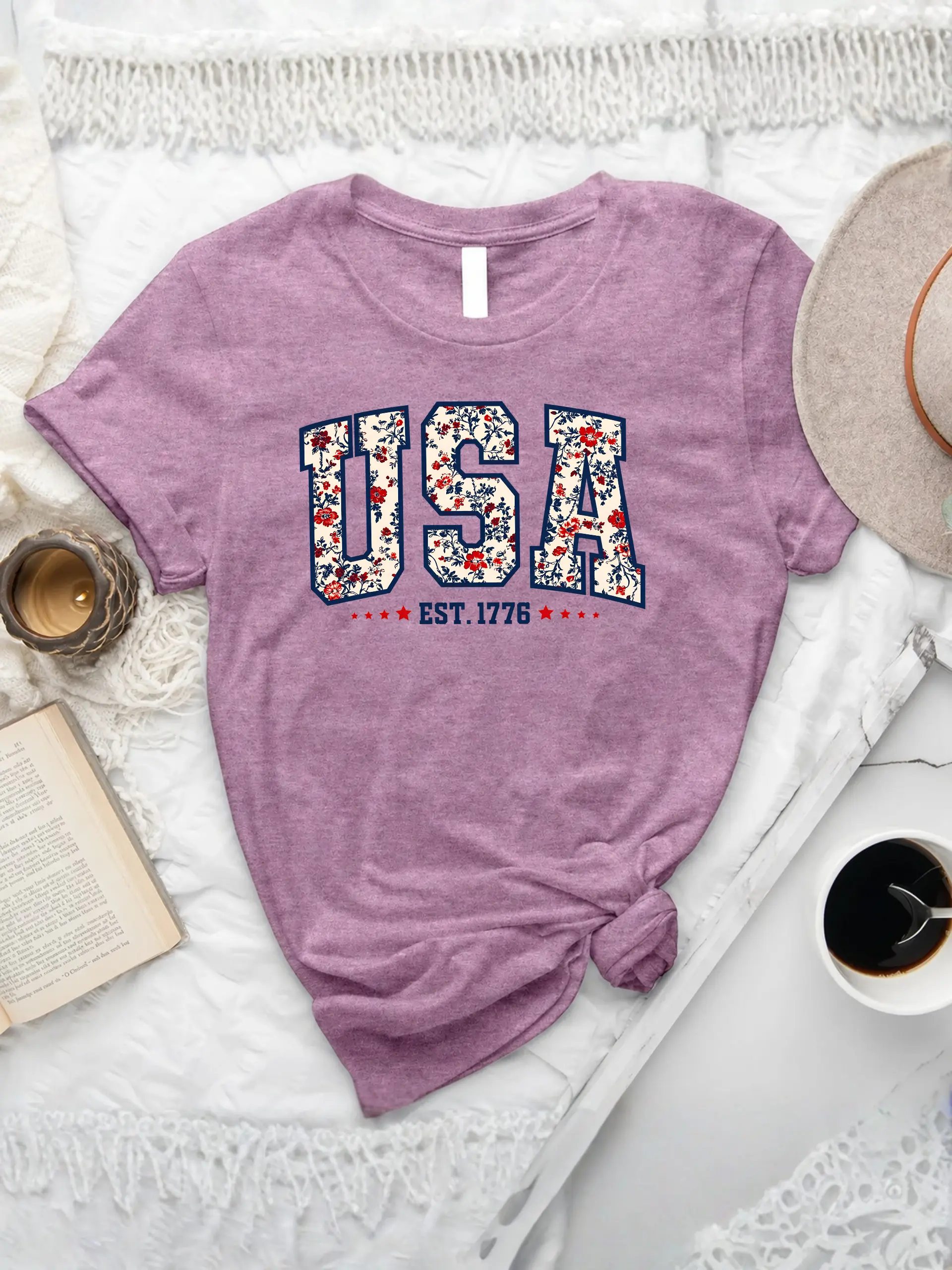 Retro Floral USA T-Shirt in Heather Orchid with red, white, and blue floral USA lettering and EST. 1776 graphic