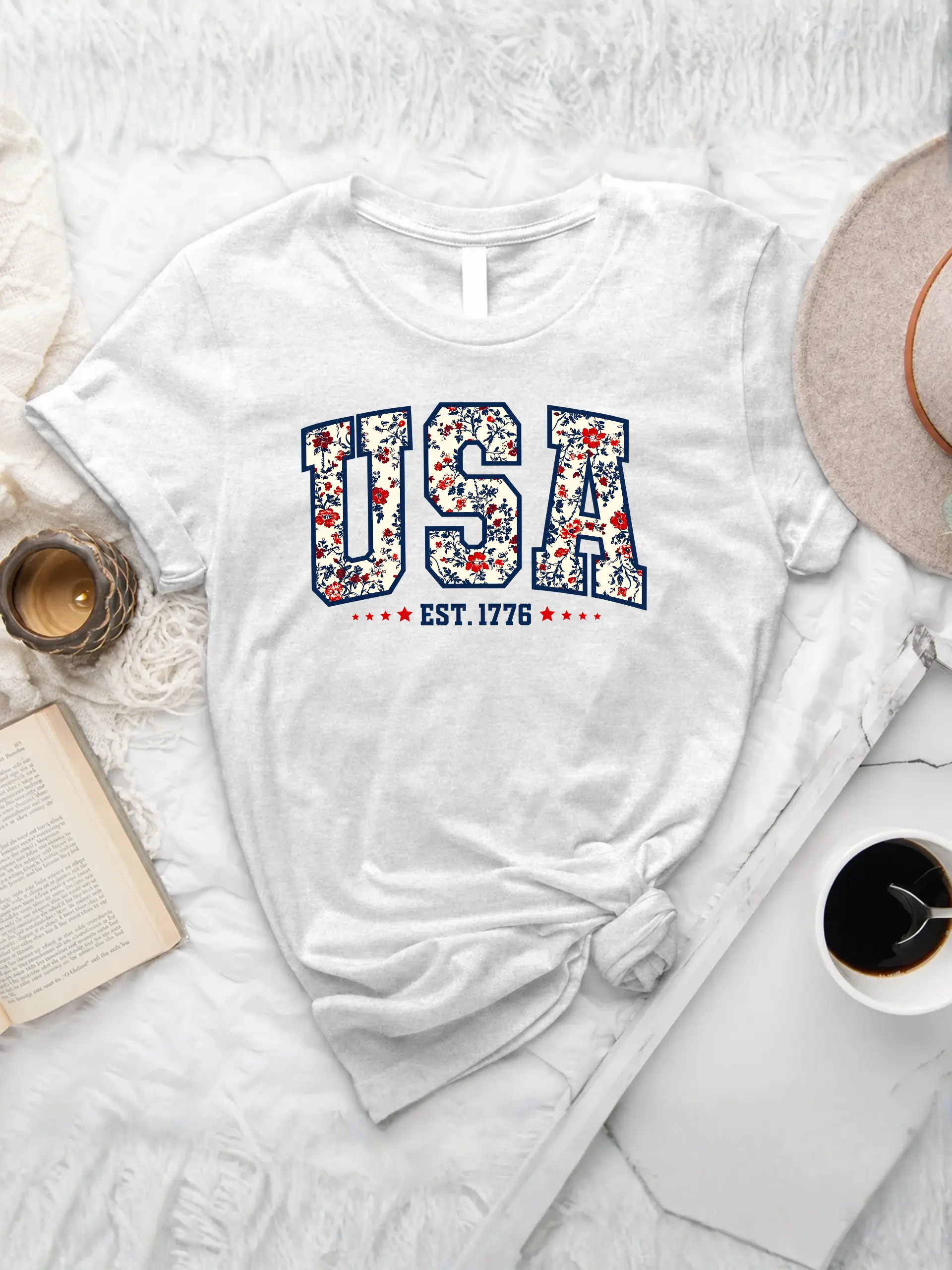 Retro Floral USA T-Shirt in White with red, white, and blue floral USA lettering and EST. 1776 graphic